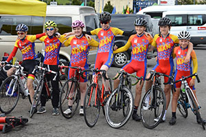 Seven cyclist posing for group photo